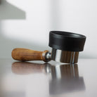 Flair 49 PRO Magnetic Funnel attached to a wood handled portafilter.