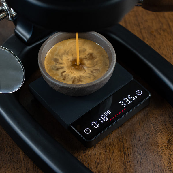 Flair Espresso Scale with espresso being brewed into it showing the time and total yield.