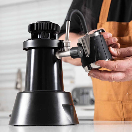 Flair eWizard electric milk steamer being used with the Flair Milk Pitcher.
