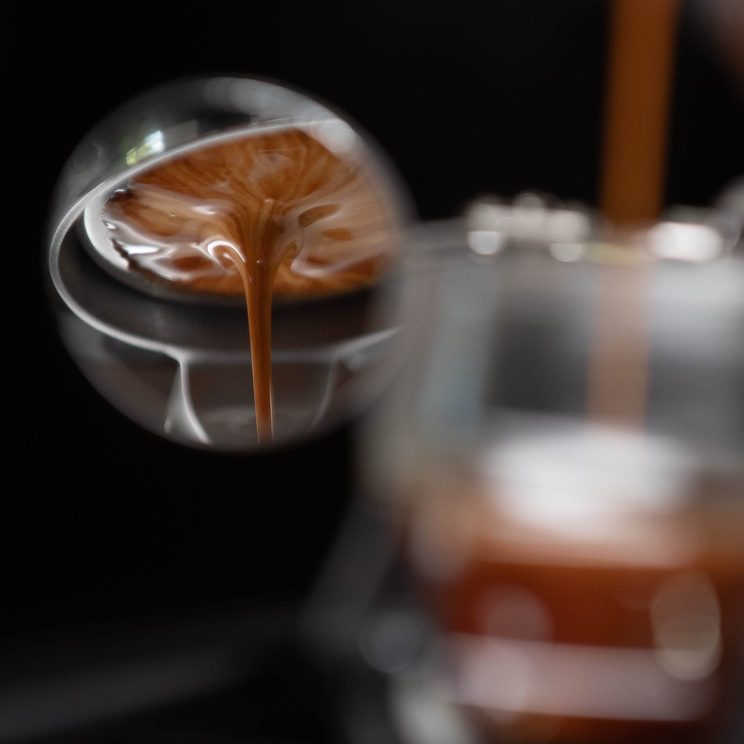 Close-up of a coffee cup with latte art, blurred background