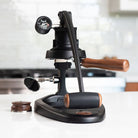 Manual coffee press on a kitchen counter with a blurred background